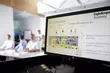 Technical training session at the EagleBurgmann Academy showing a mechanical seal diagram on screen.